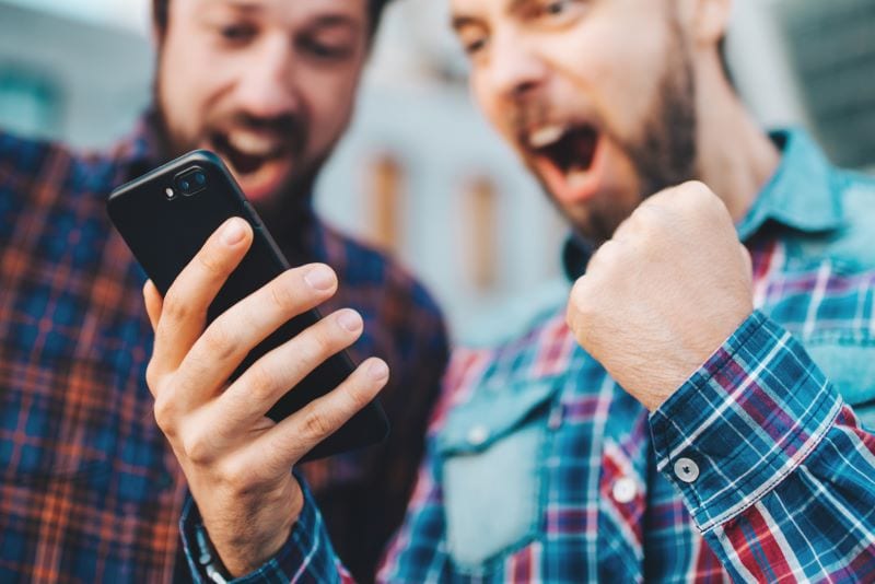 Cheering whilst using a mobile phone for age verification