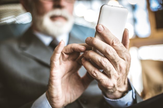 Old person using a mobile phone